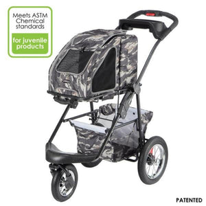 an army camo dog carrier on a black stroller and an army camo organizer at the bottom of it 
