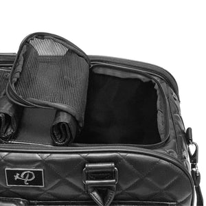 close up image of a black dog carrier with one of the top lids opened 