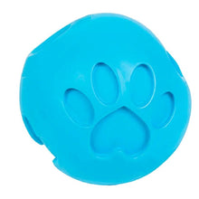 a close up image of a blue dog ball treat dispenser with paw engraved to it