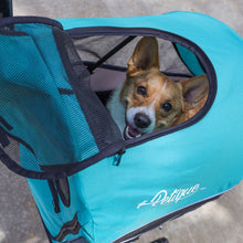 close up image of a happy dog inside a neptune colored Dog Jogger Stroller 