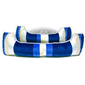 two blue dog beds stacked together.
