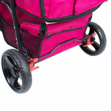 a close up image of the back of a razzberry colored dog stroller and its back wheels and red break lock 