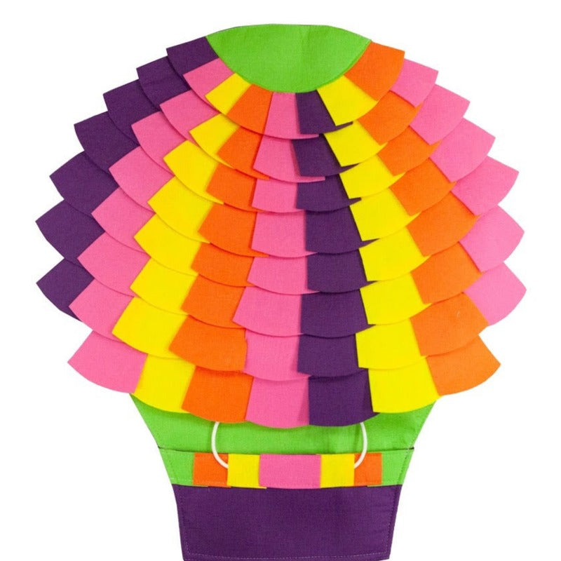 a tropical colored puzzle pad for dogs arranged like a hot air balloon