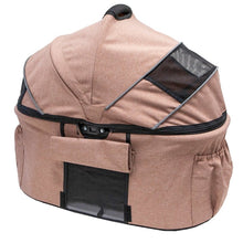 a dessert rose colored dog carrier with top lid closed and side pockets