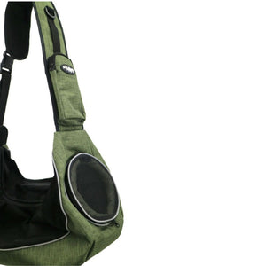 a green sling pet carrier where you can see it's breathing hole