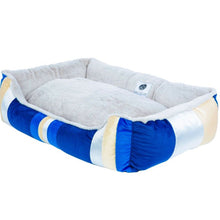 side view image of a blue dog bed 
