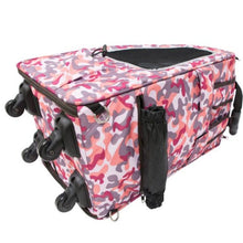 a laid down pink camo dog carrier showing its wheels and side pockets