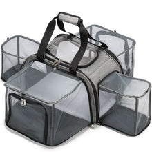 full top image of a grey dog camper/carrier with strap handles
