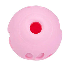 a close up image of the hole of the pink dog ball dispenser 