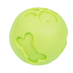 a close up image of a green dog ball treat dispenser with paw and bone engraved to it 