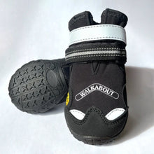 a close up image of a pair of black Muckbuster dog boots with reflective straps