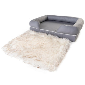 a full view image of a topper and a fluffy rectangular dog bed in white background 