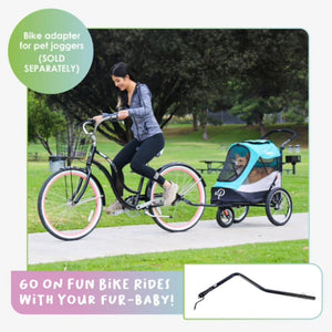 a poster of a lady ridding a bicycle with her dog inside a blue Dog Jogger Stroller attached to it at the park