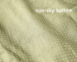 a close up image of a now slip bottom fabric of a dog couch lounger 