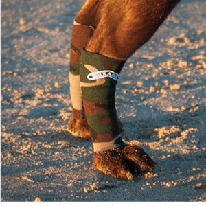 A close up image of a hind leg of a dog wearing a Camo Walkabout Compression Sleeve