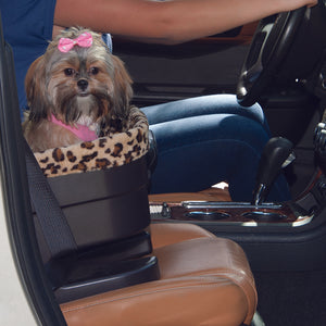 A close up picture of a shih-tzu next to inside a Bucket Seat Dog Booster with Jaguar Insert, 17" next to a lady driving a car 