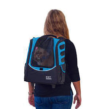 a lady in black carrying her dog through an ocean blue 5-in-1 Pet Carrier [Backpack/Tote/Roller Bag/Carrier/Car Seat on her back