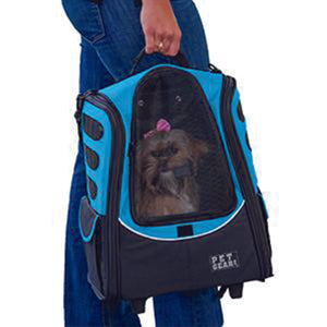 a shih-tzu inside of an ocean blue 5-in-1 Pet Carrier [Backpack/Tote/Roller Bag/Carrier/Car Seat being carried by  a lady 