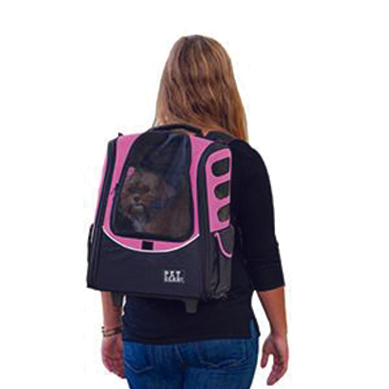 a lady carrying her dog on her back through a pink -in-1 Pet Carrier [Backpack/Tote/Roller Bag/Carrier/Car Seat