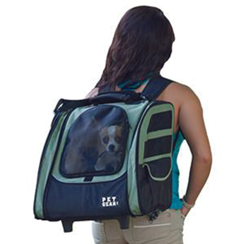 a lady carrying her dog on her back inside a  5-in-1 Pet Carrier Backpack/Tote/Roller Bag/Carrier/Car Seat, Sage