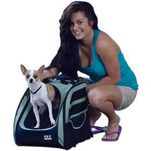 a lady sitting next to her dog that is standing on a 5-in-1 Pet Carrier Backpack/Tote/Roller Bag/Carrier/Car Seat, Sage
