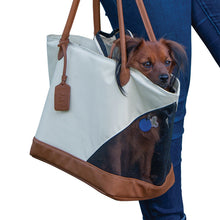 a close up image of a dog sticking his head out of a Rest & Relax Tote Bag, Sand