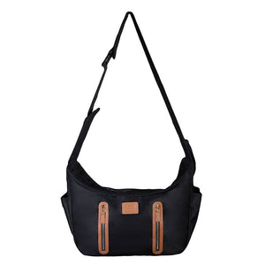a close up image of a black Sling Pet Carrier Purse,
