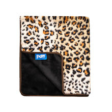 A cheetah printed waterproof dog blanket almost folded in half showing the logo of paw.com in black background